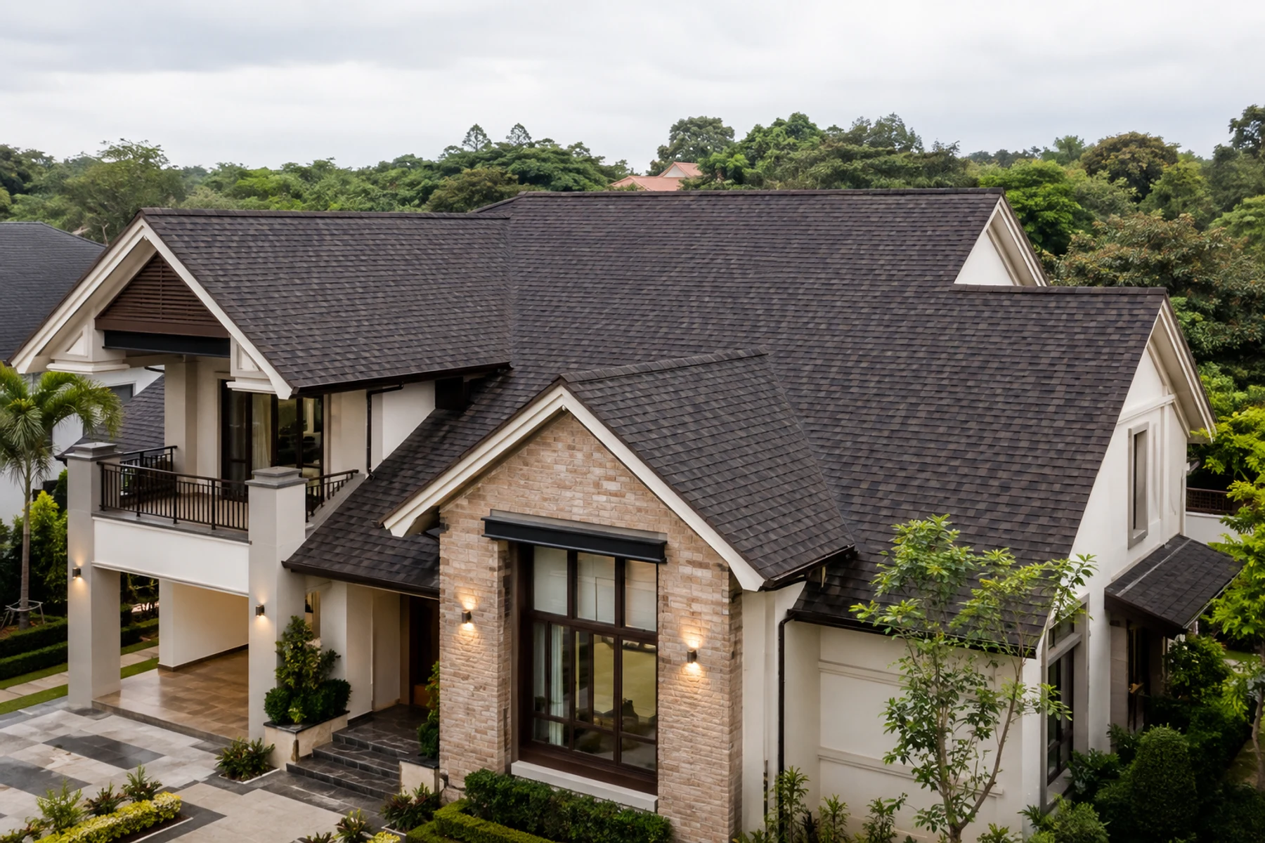 Completed architectural shingle roof on a sloped residence