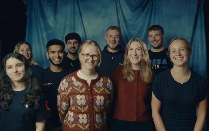 Nine members of the Halo team standing together for a group photograph