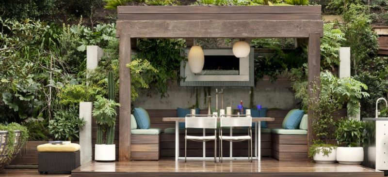 A wooden dining set on a outdoor patio