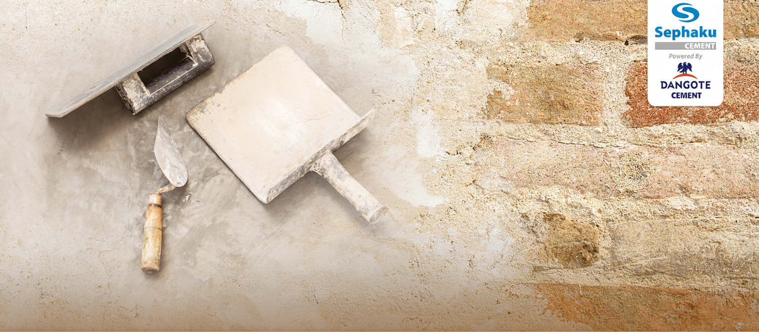 Plastering tools with half plastered wall