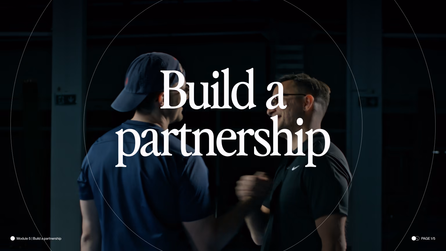 Two men shaking hands and smiling in a dimly lit room with text 'Build a partnership' overlay.