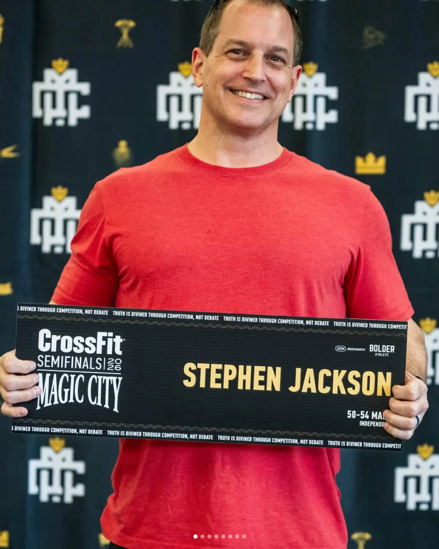 Sentinel athlete Stephen Jackson holding his CrossFit Semifinals Magic City name card.