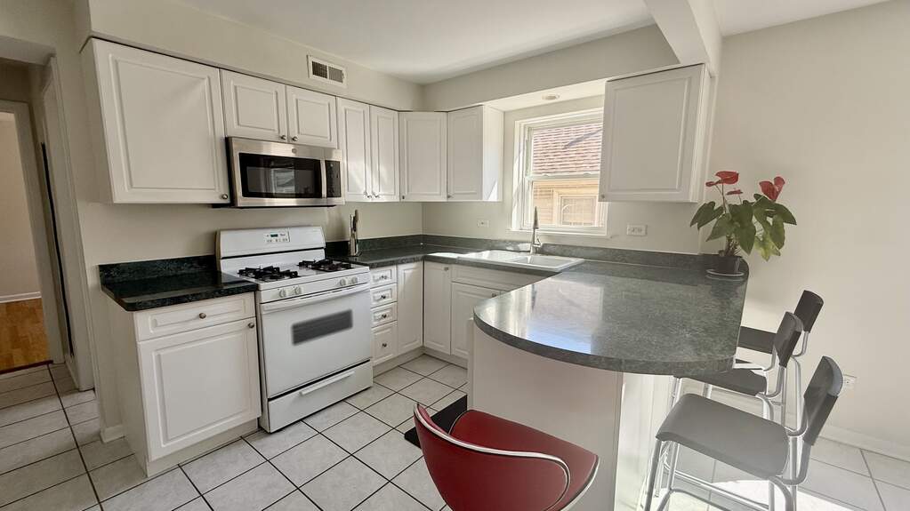 Designer kitchen and refined entertaining spaces