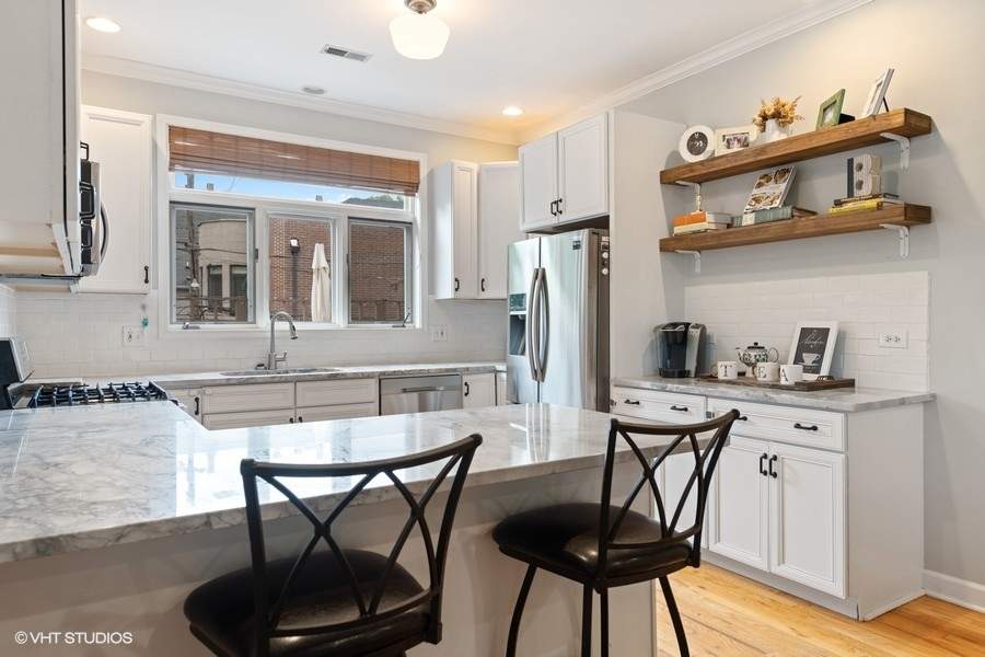 Designer kitchen and refined entertaining spaces