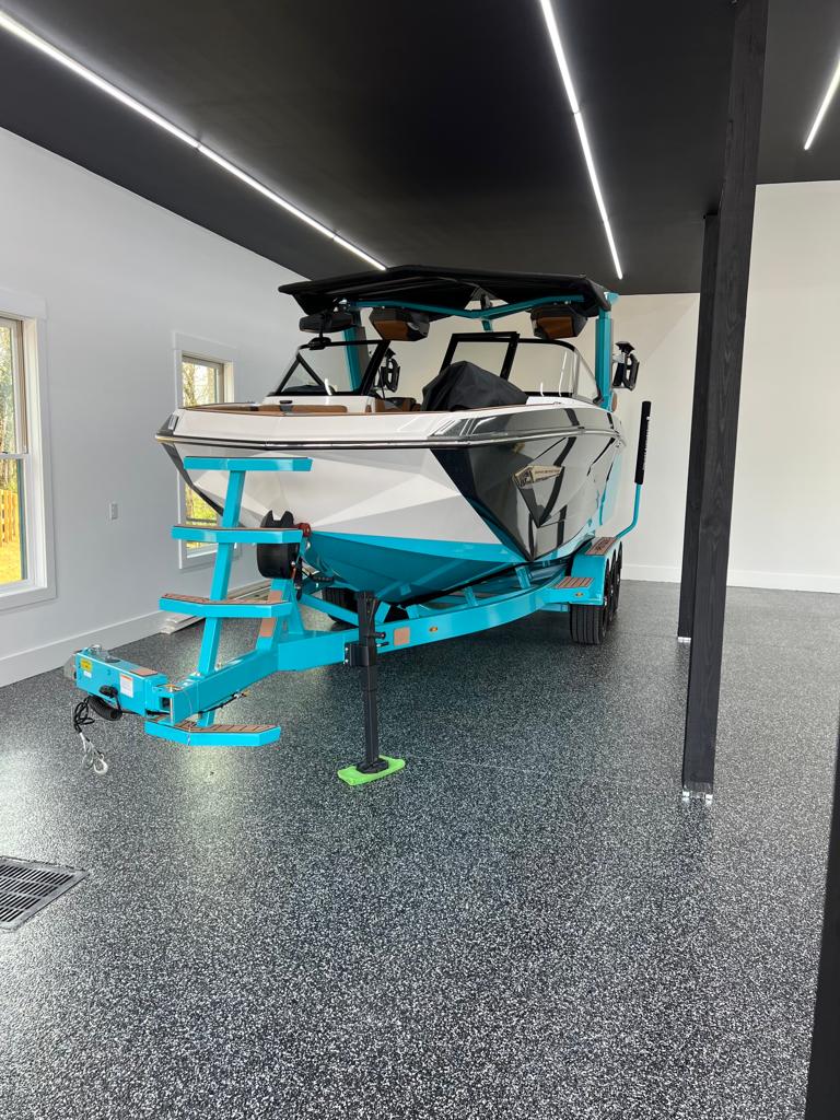 Garage flooring with wakeboarding boat