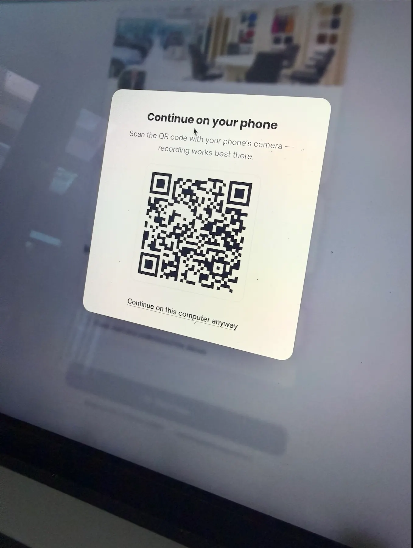 Service advisor showing a QR code on a tablet to start a capture