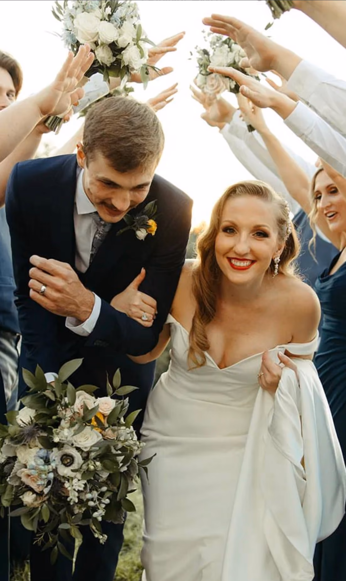Bride and groom celebrating with their wedding party
