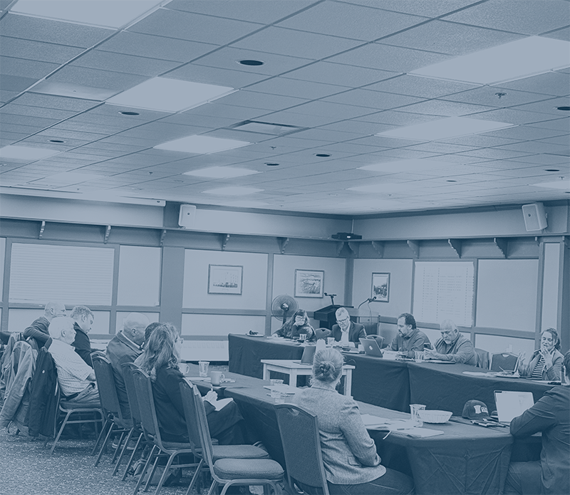 Participants seated around conference tables for an Investor Table discussion.