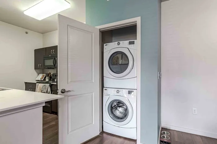 Stacked washer and dryer in closet