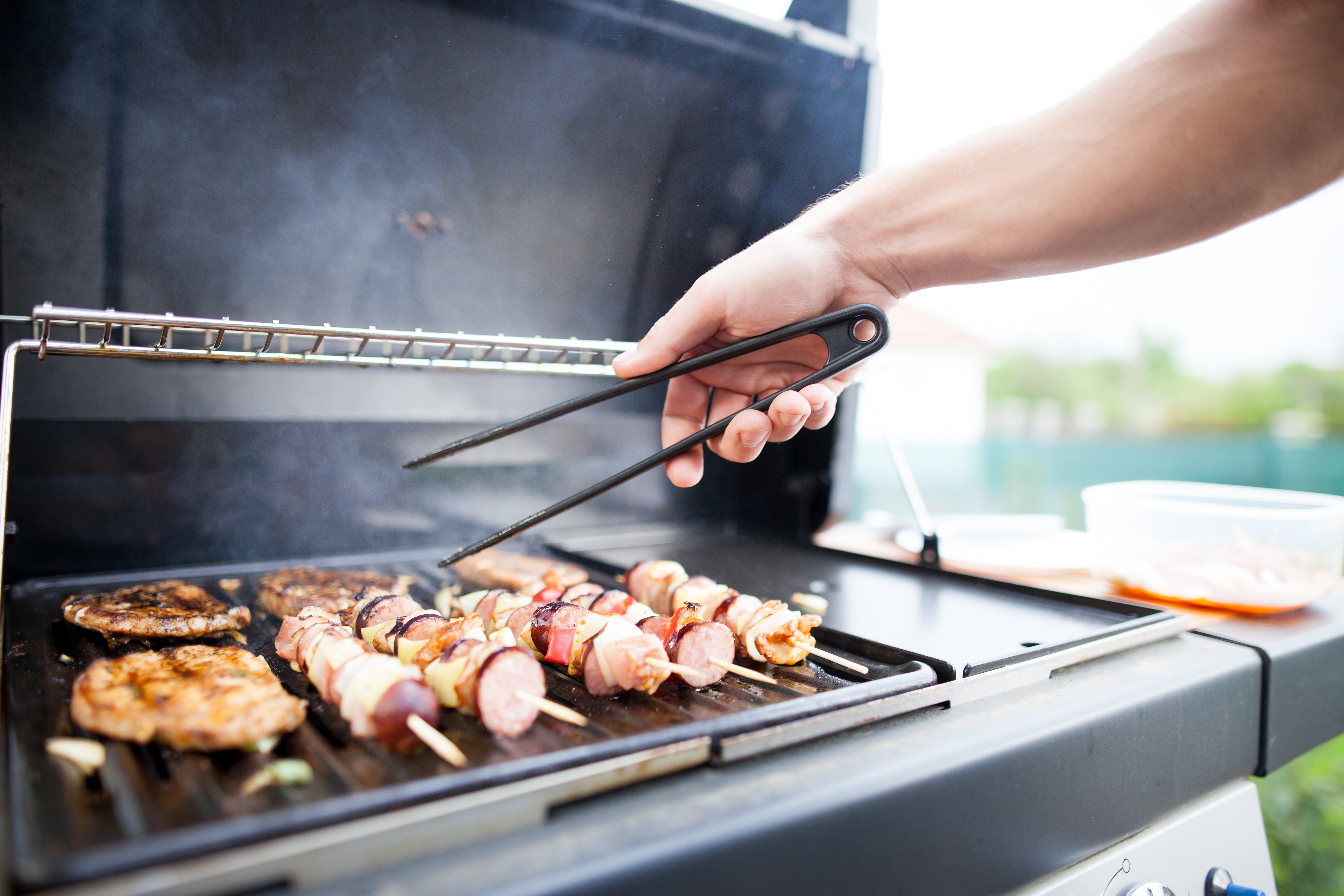 Person grilling food stock image