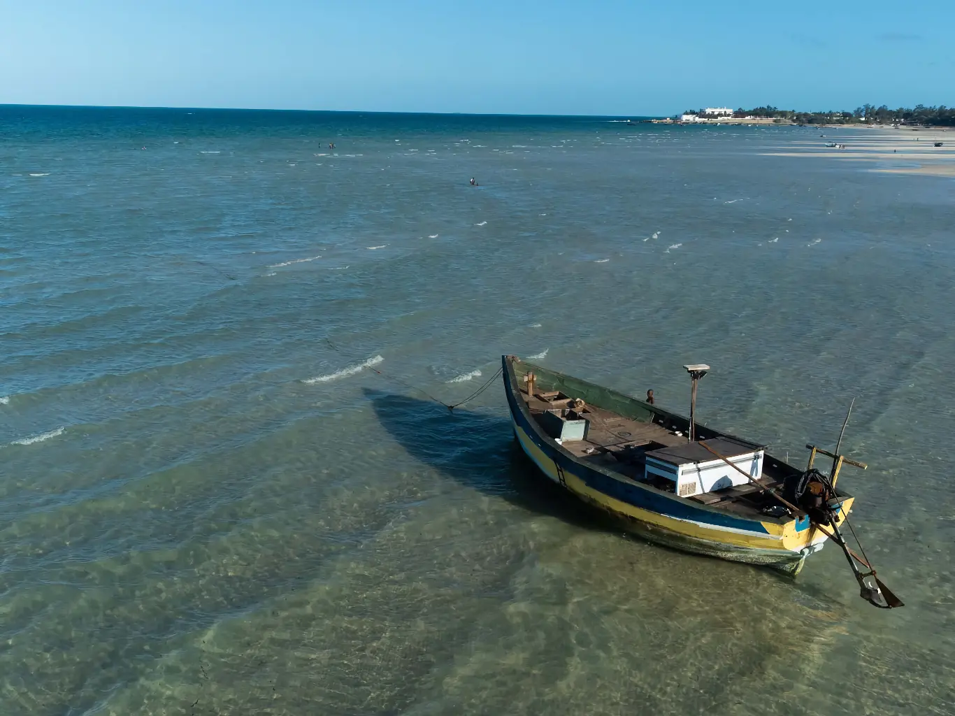Traditional dhow sailing across the turquoise waters off the coast of Vilanculos, Mozambique.