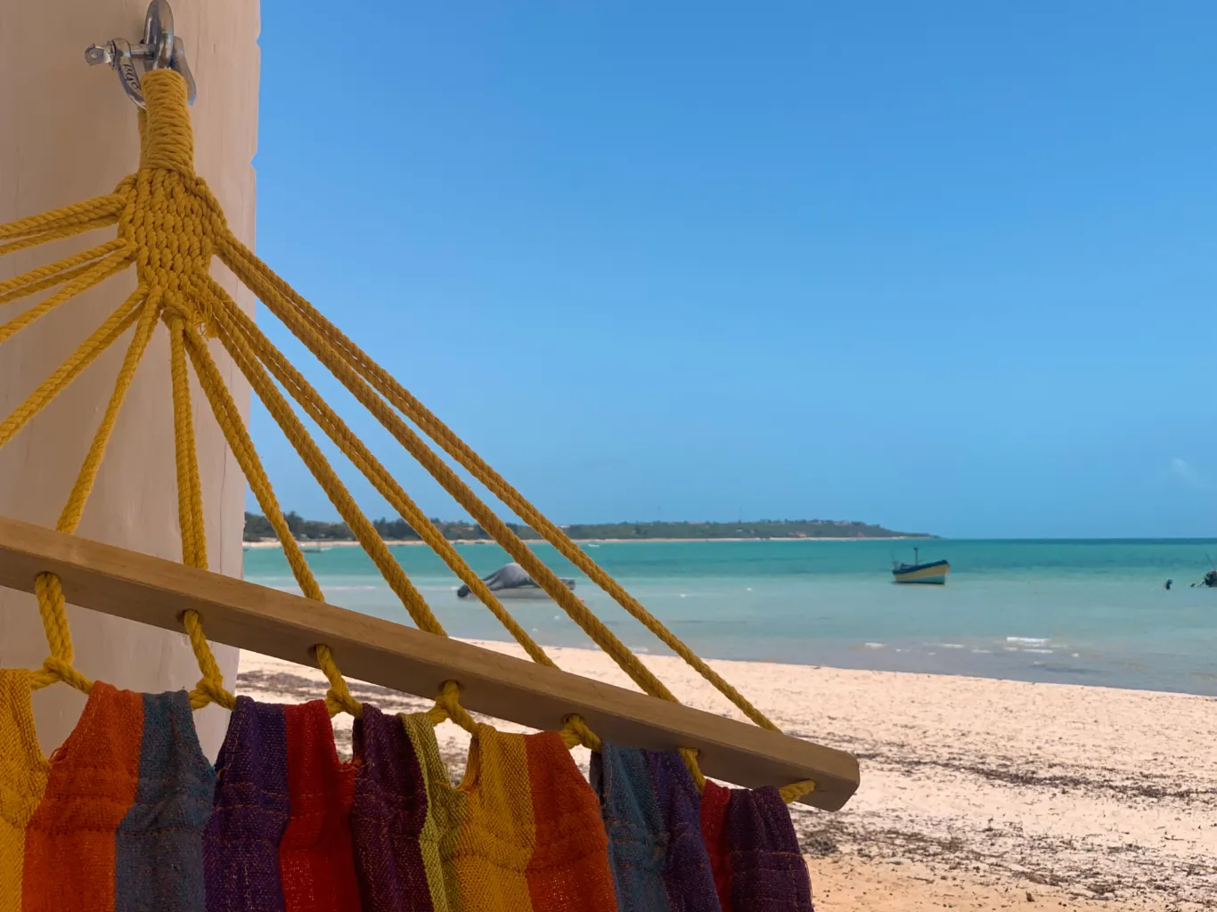 Scenic beach view from SAMARA Lodge Vilanculos, overlooking the sandy shoreline and turquoise waters of the Indian Ocean in Mozambique.
