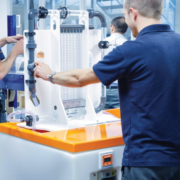 Student working on a didactic training rig