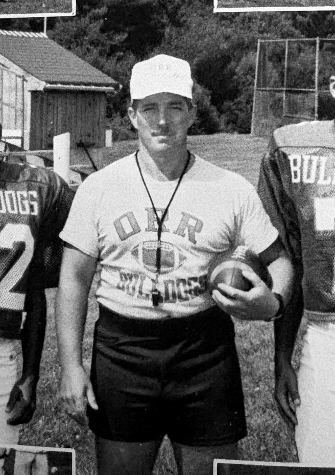 Craig R. Sherman coaching Old Rochester Regional football on the field