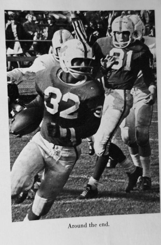 Old Rochester football player running around the end during the 1965 season