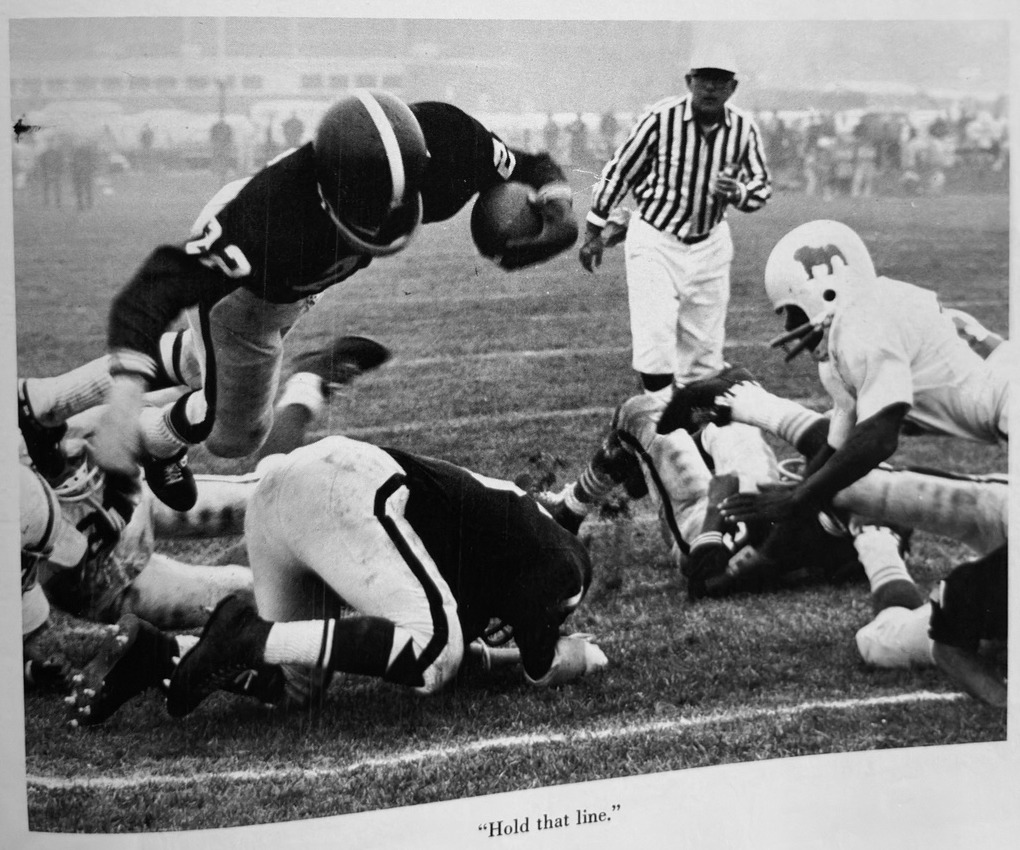 Old Rochester football players battling at the line during the 1965 season