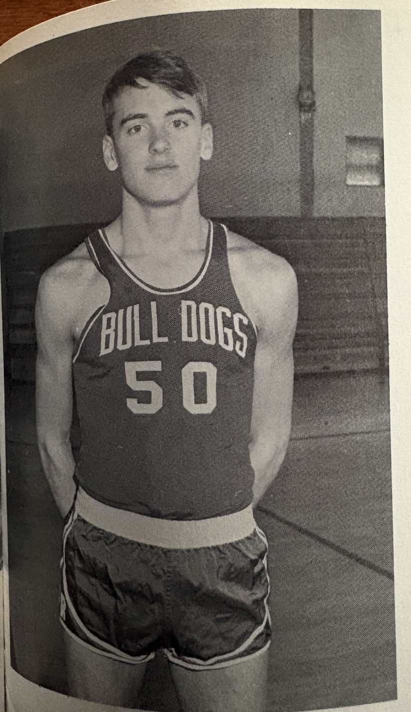 Peter Trow standing in a Bulldogs number 50 junior varsity basketball uniform