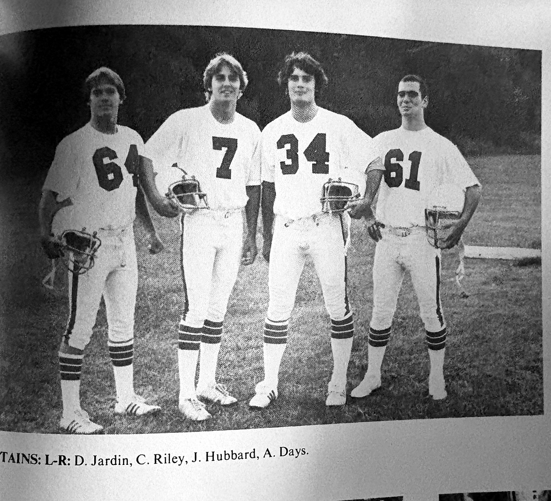 Christopher Riley, number 7, standing with Old Rochester Regional football captains D. Jardin, J. Hubbard, and A. Days