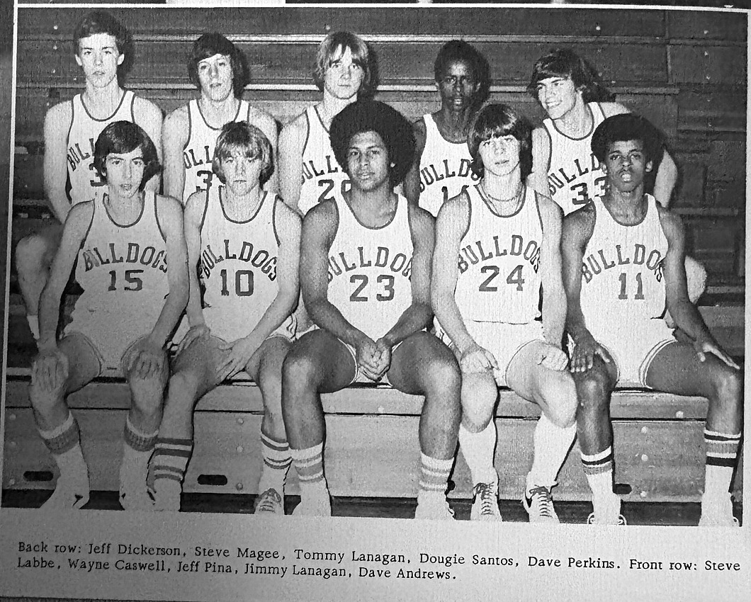 Old Rochester Regional basketball players with Jeffrey Pina, number 23, seated in the center of the front row