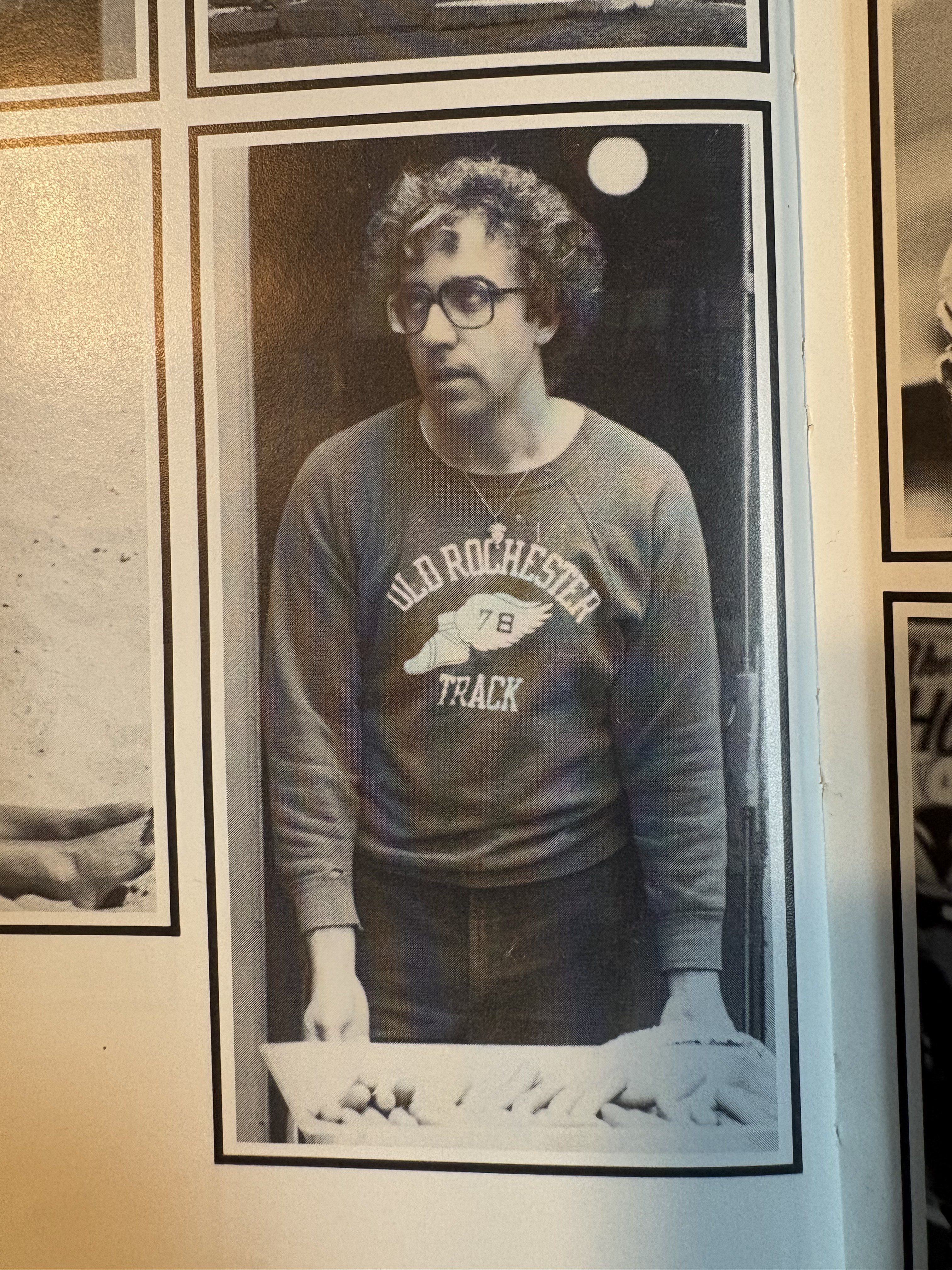 Joao Rodrigues wearing an Old Rochester Track sweatshirt in an ORR yearbook photograph
