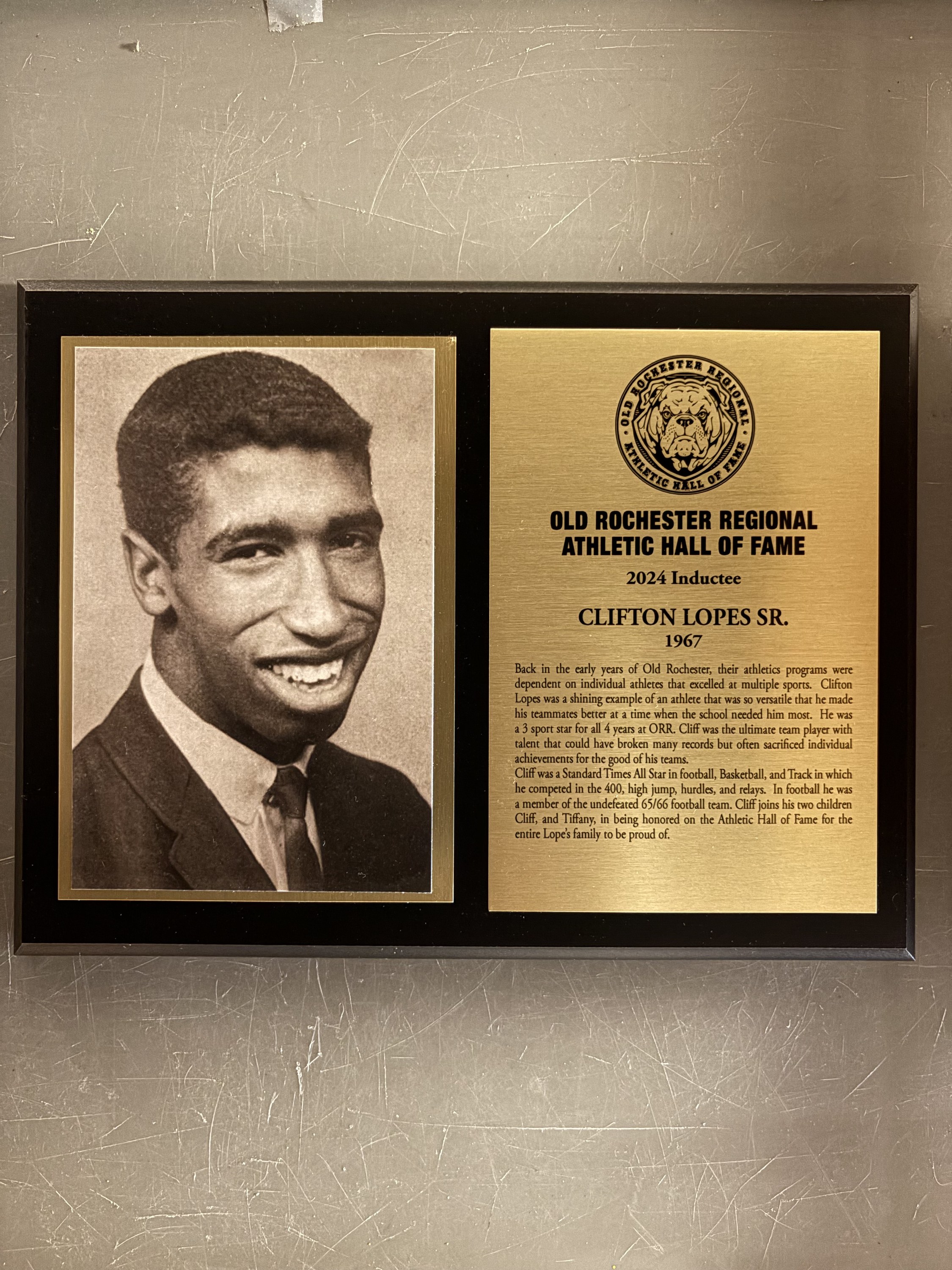 Clifton Lopes Sr.'s complete 2024 Hall of Fame display with portrait and plaque