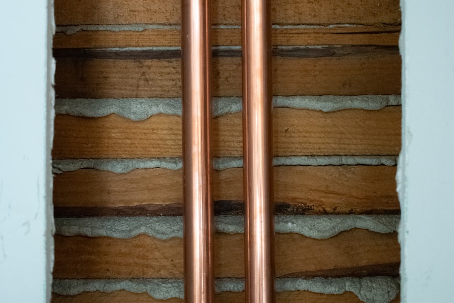 Copper supply pipes running up a wall.