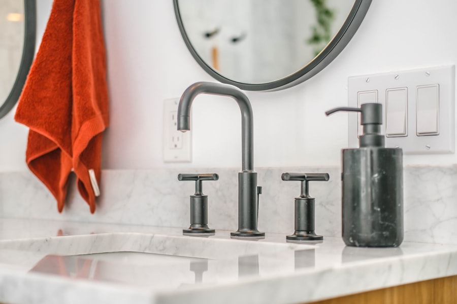 Bathroom vanity with chrome fixtures and a mirror.