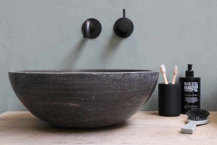 Stone vessel basin with wall-mounted taps.