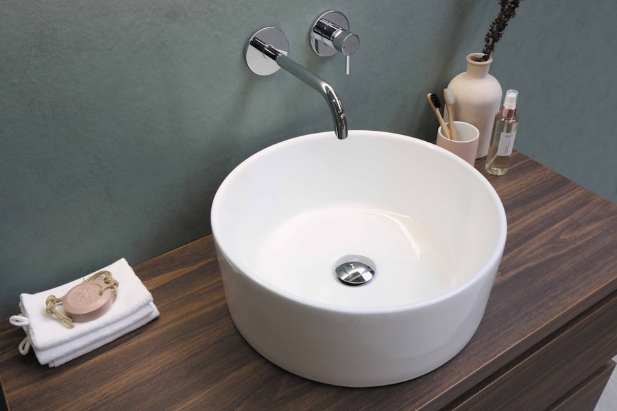 Vessel basin with a wall-mounted faucet on a timber vanity.