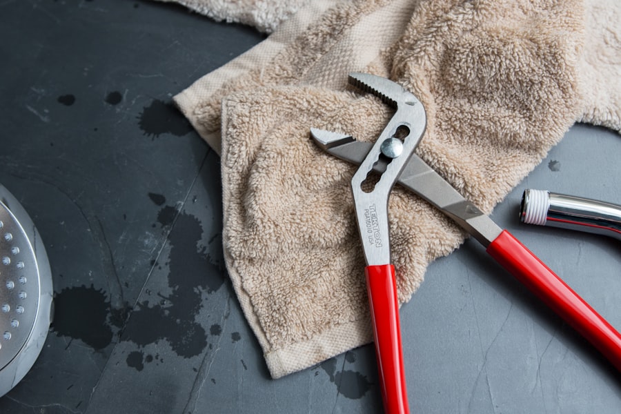 Pipe wrench and cloth on a work surface.