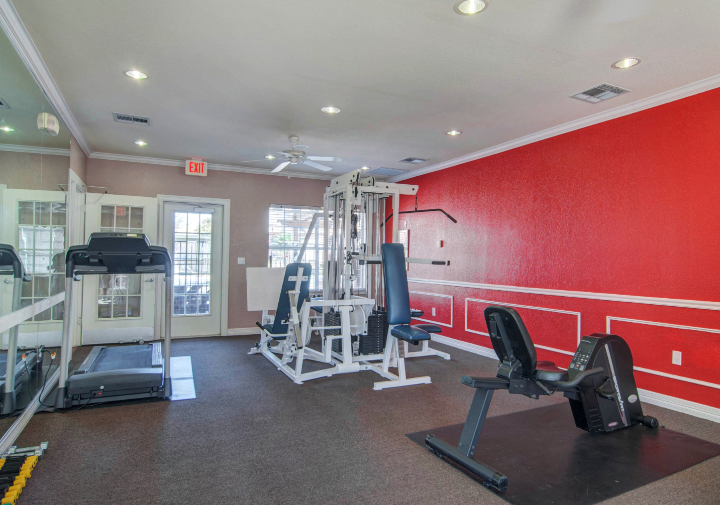 Fitness center with weight machine and treadmill