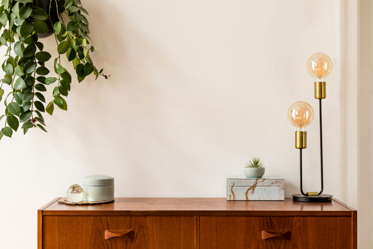Cabinet with decor candles and plant stock iamge