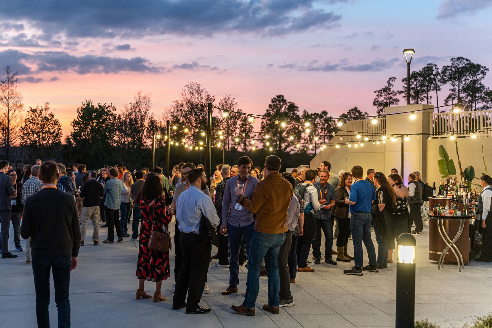 AGBT attendees at an evening reception outside the meeting venue