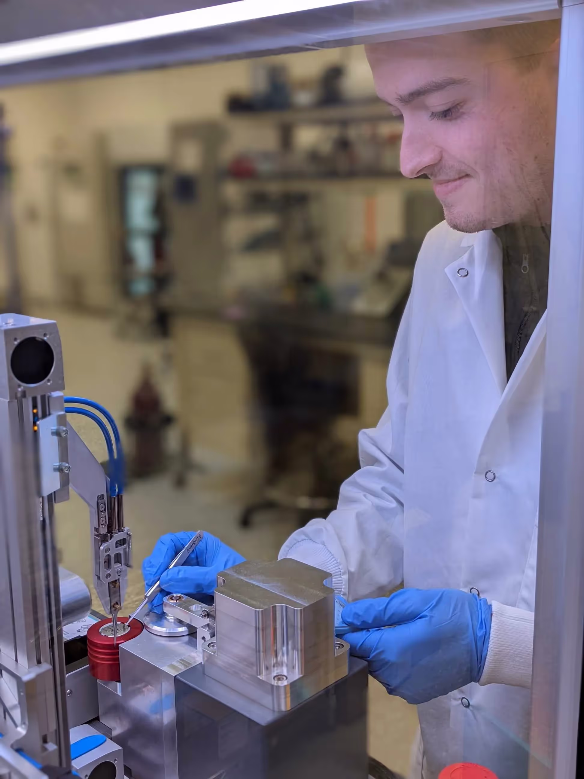 Scientist operating the SPT Labtech chameleon for rapid cryo-EM grid vitrification