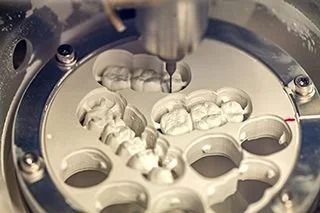 Dental milling machine creating a same-day crown