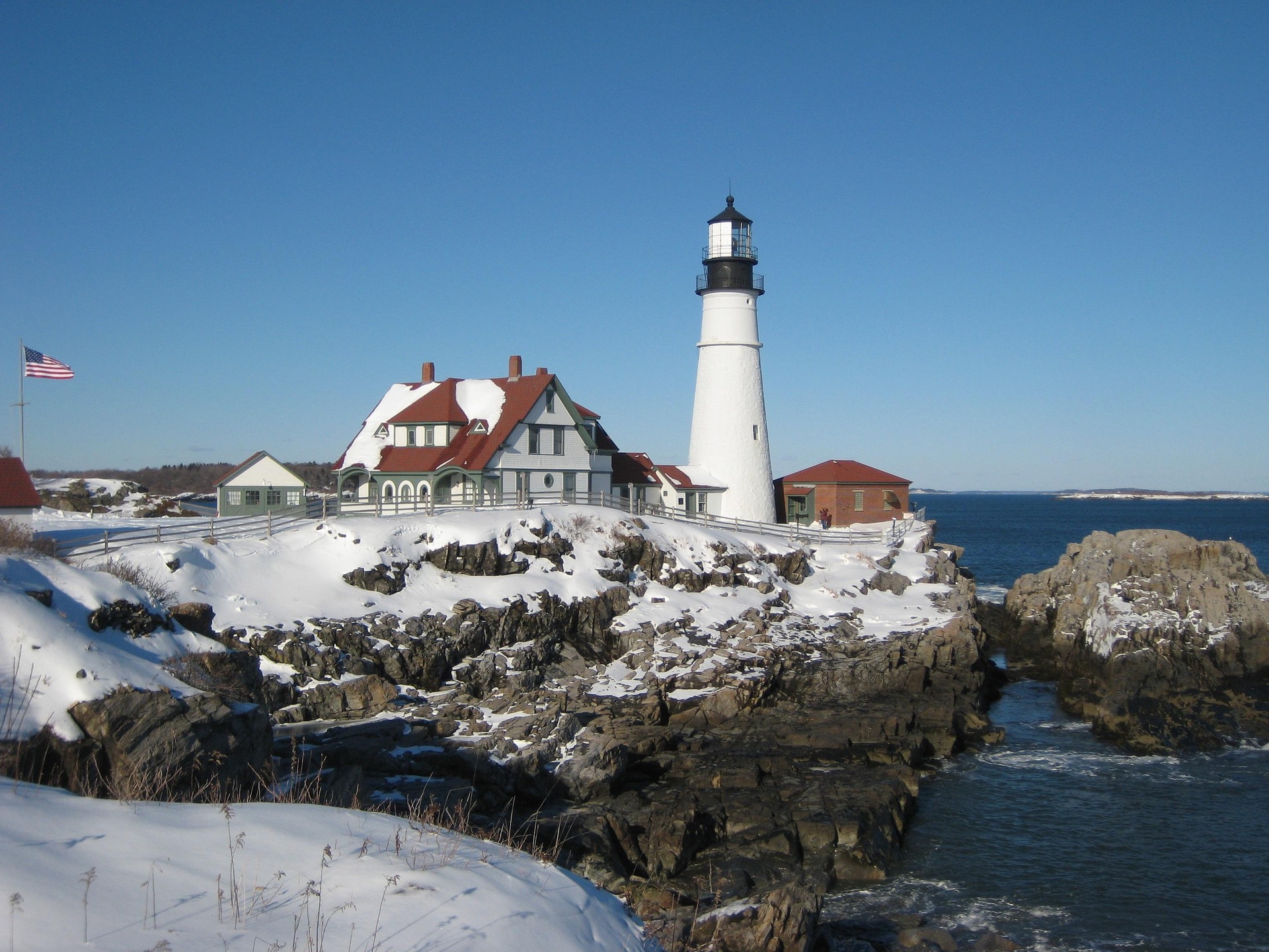 A coastal lighthouse standing above the rocks