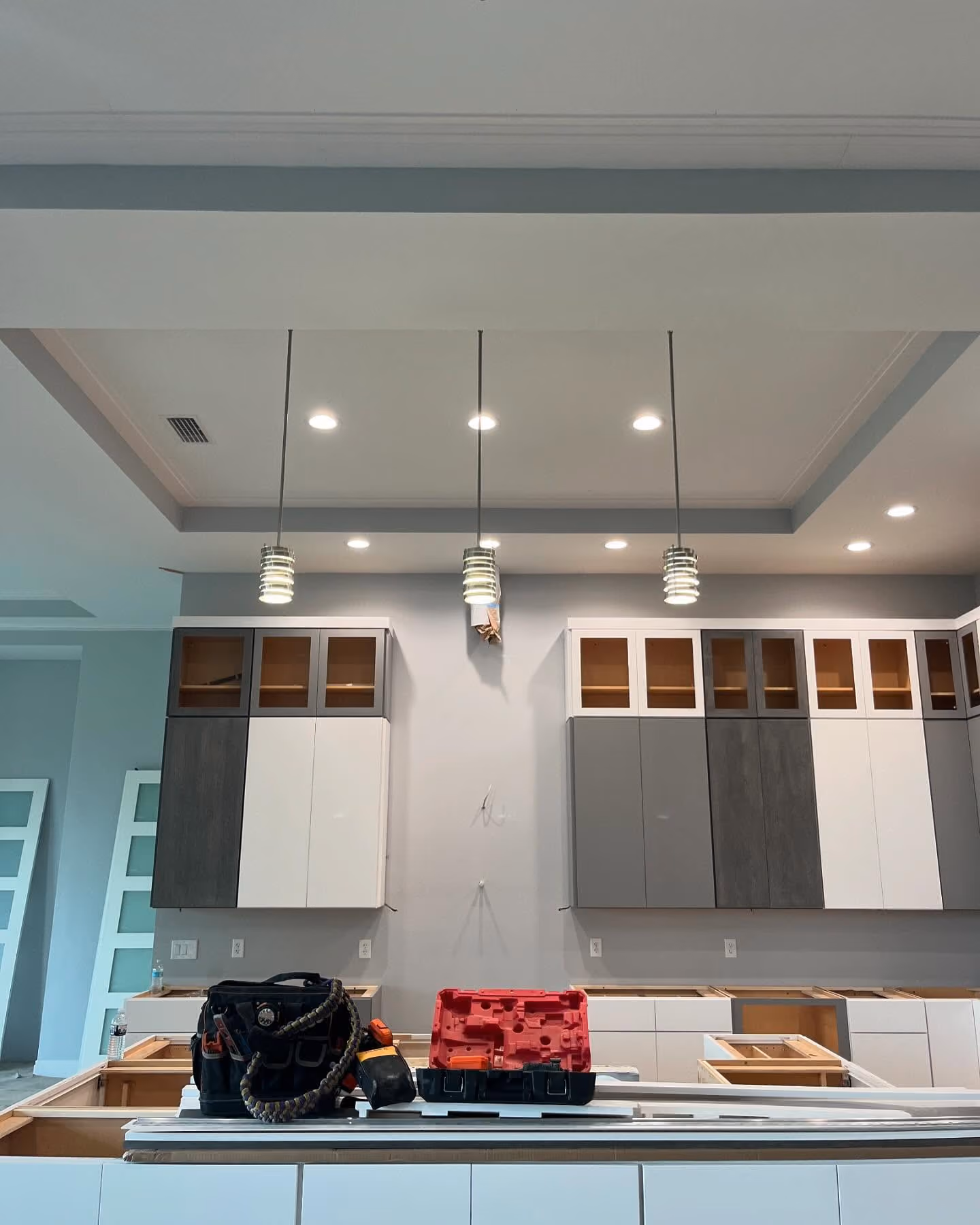 Finished kitchen remodel with updated decorative lighting and electrical work.