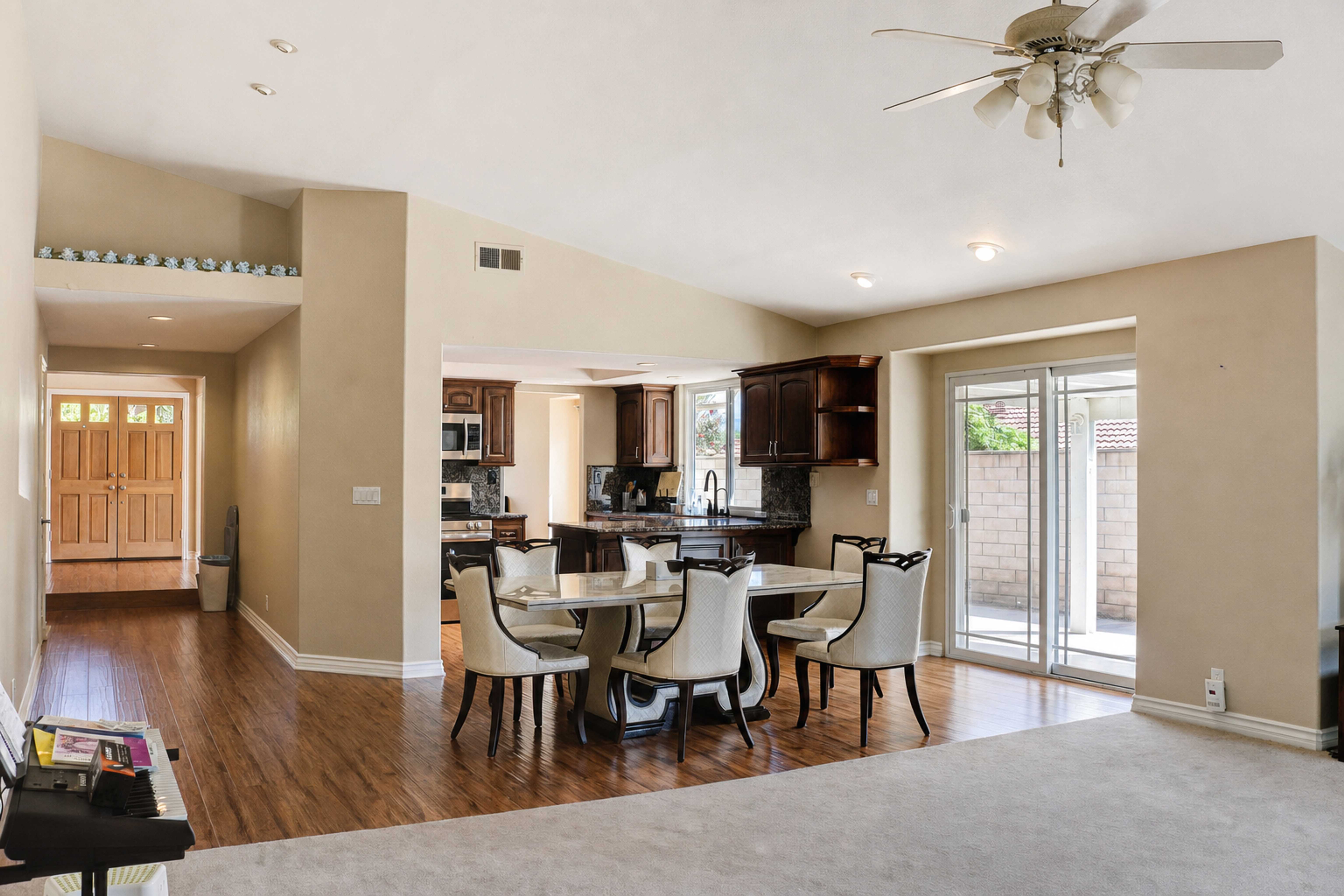 Dining area open to the kitchen under a vaulted ceiling, Anaheim short-term rental