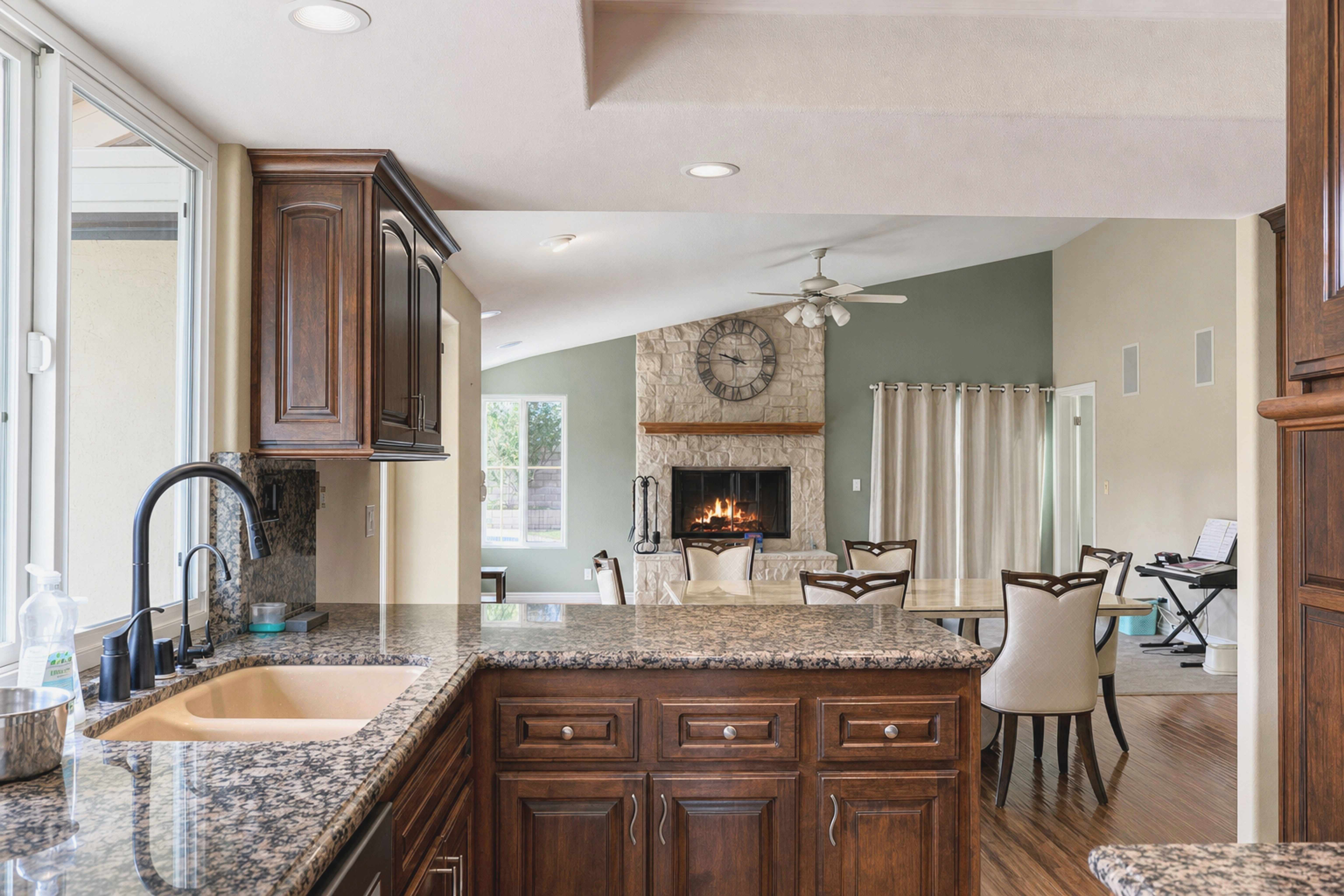 Granite island kitchen opening onto the family room and fireplace, Anaheim short-term rental