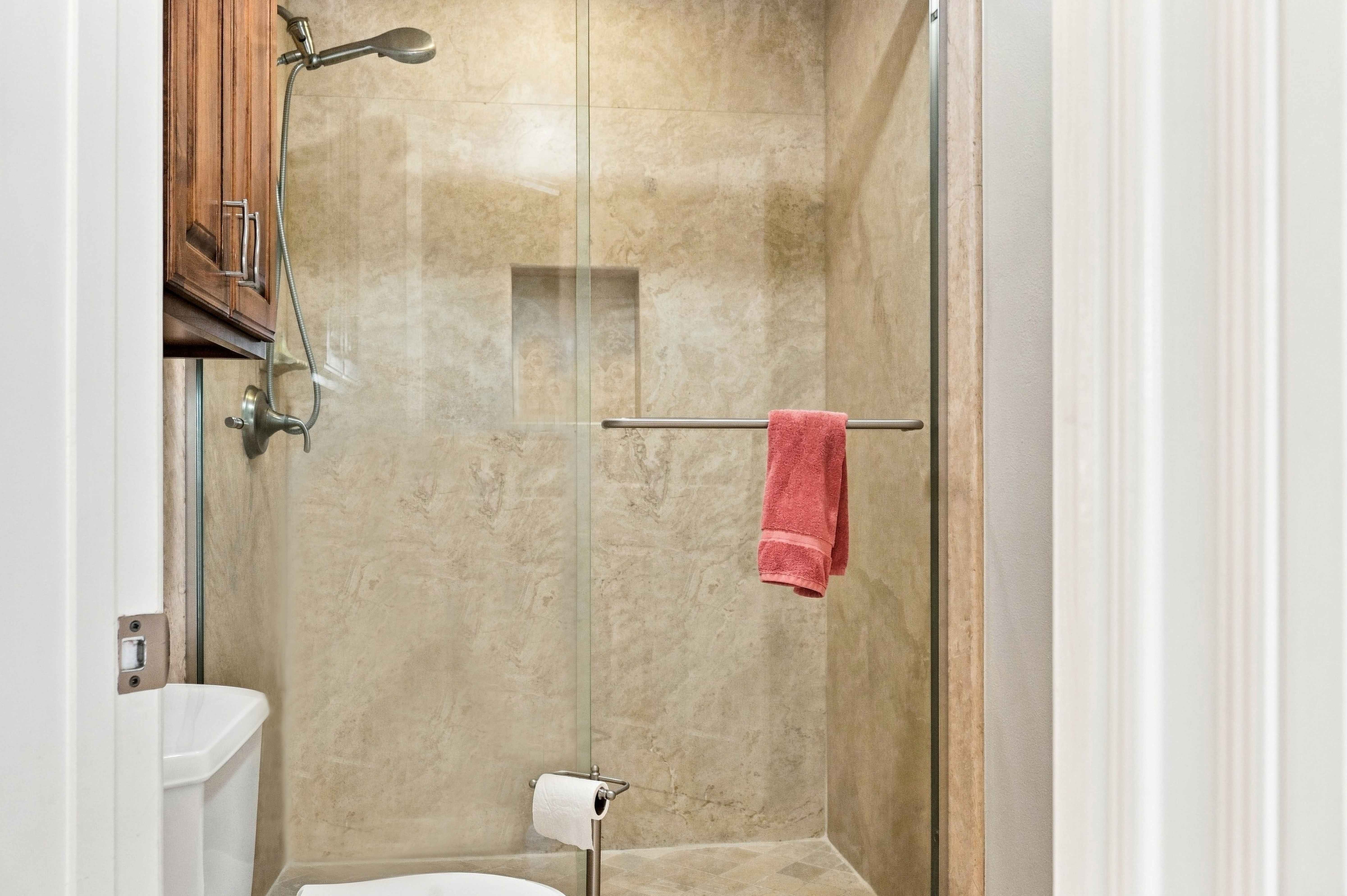 Tiled walk-in shower with built-in niche, Anaheim short-term rental bathroom