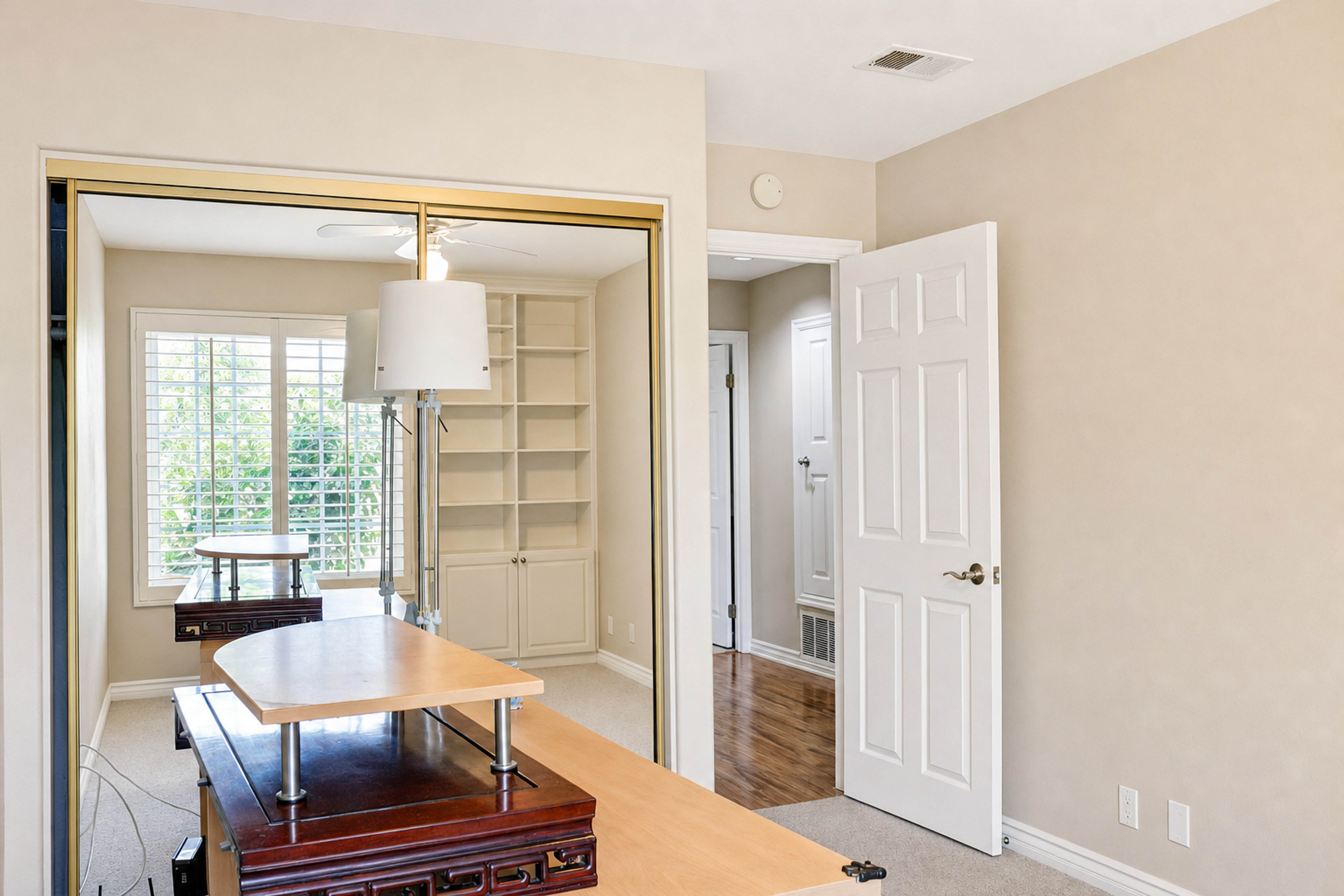 Home office with desk, window and mirrored closet doors, Anaheim short-term rental