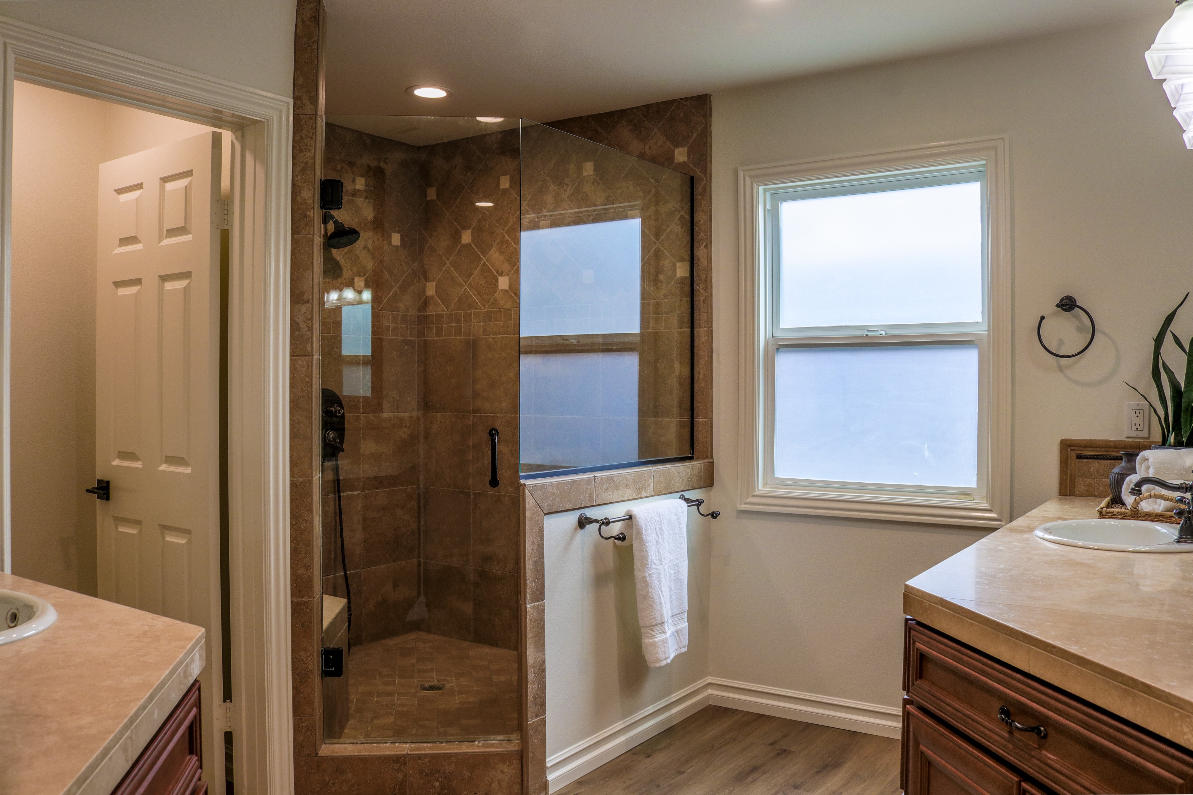 Bathroom with tiled walk-in shower and window, Tustin home for sale