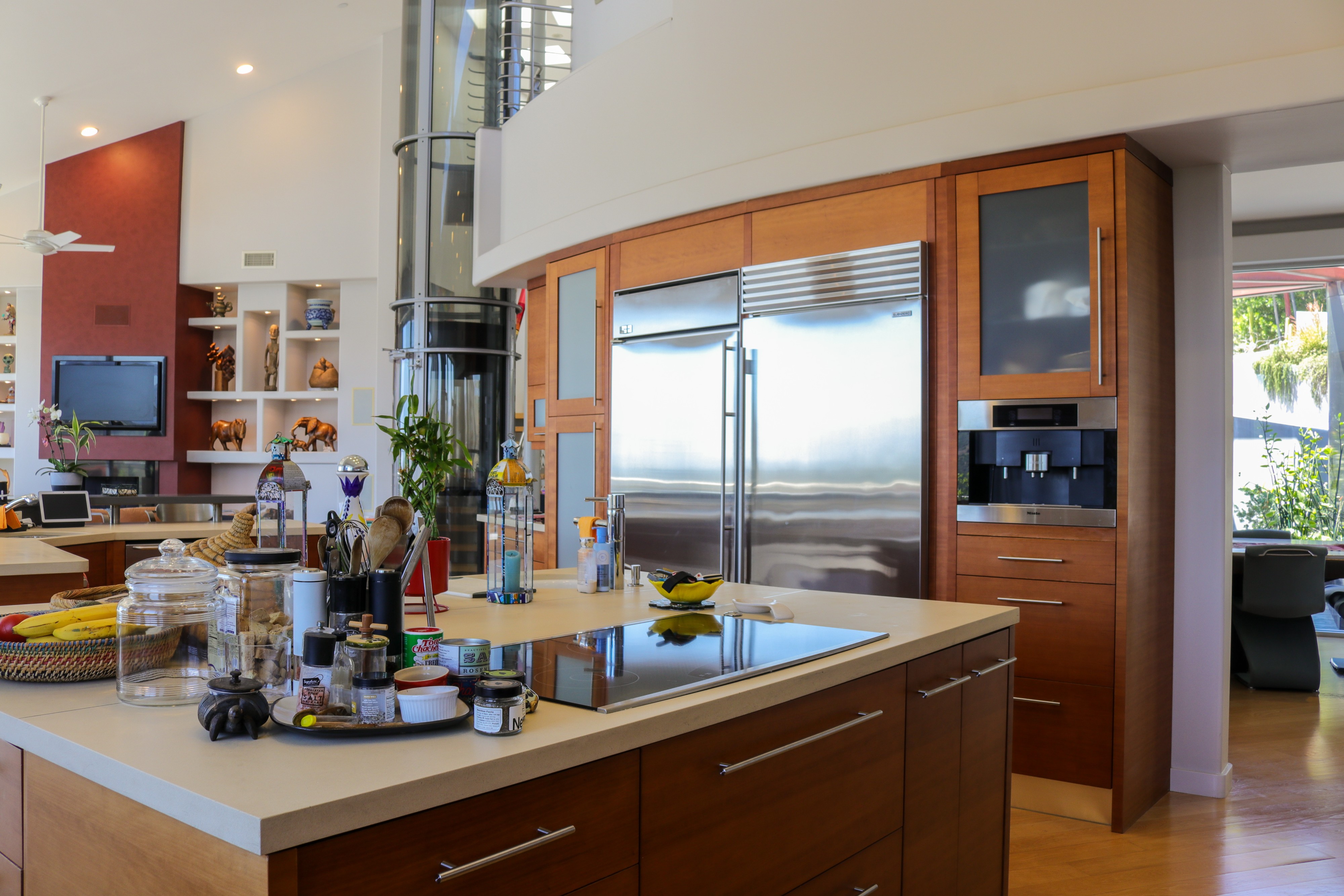Kitchen island with seating and windows framing the valley, Tustin hillside home