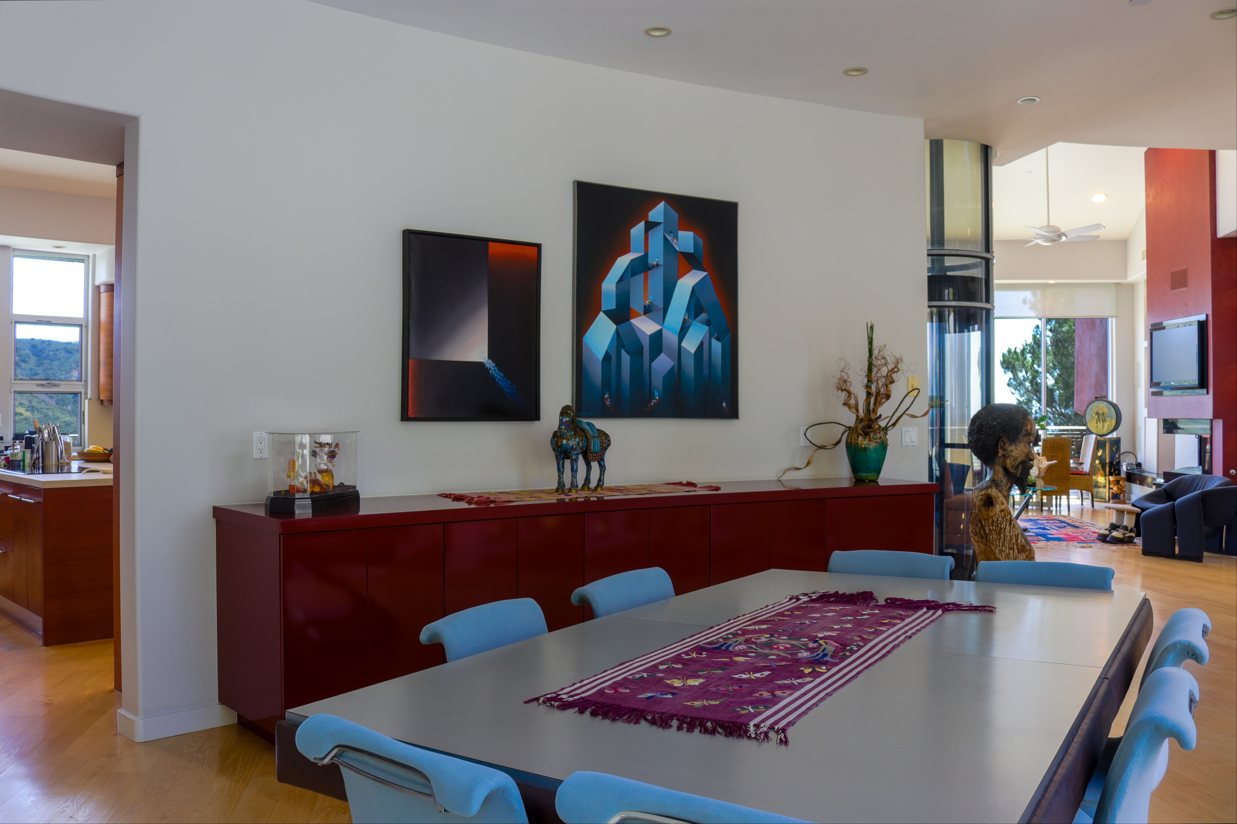 Formal dining room with long table and contemporary artwork, Tustin hillside listing