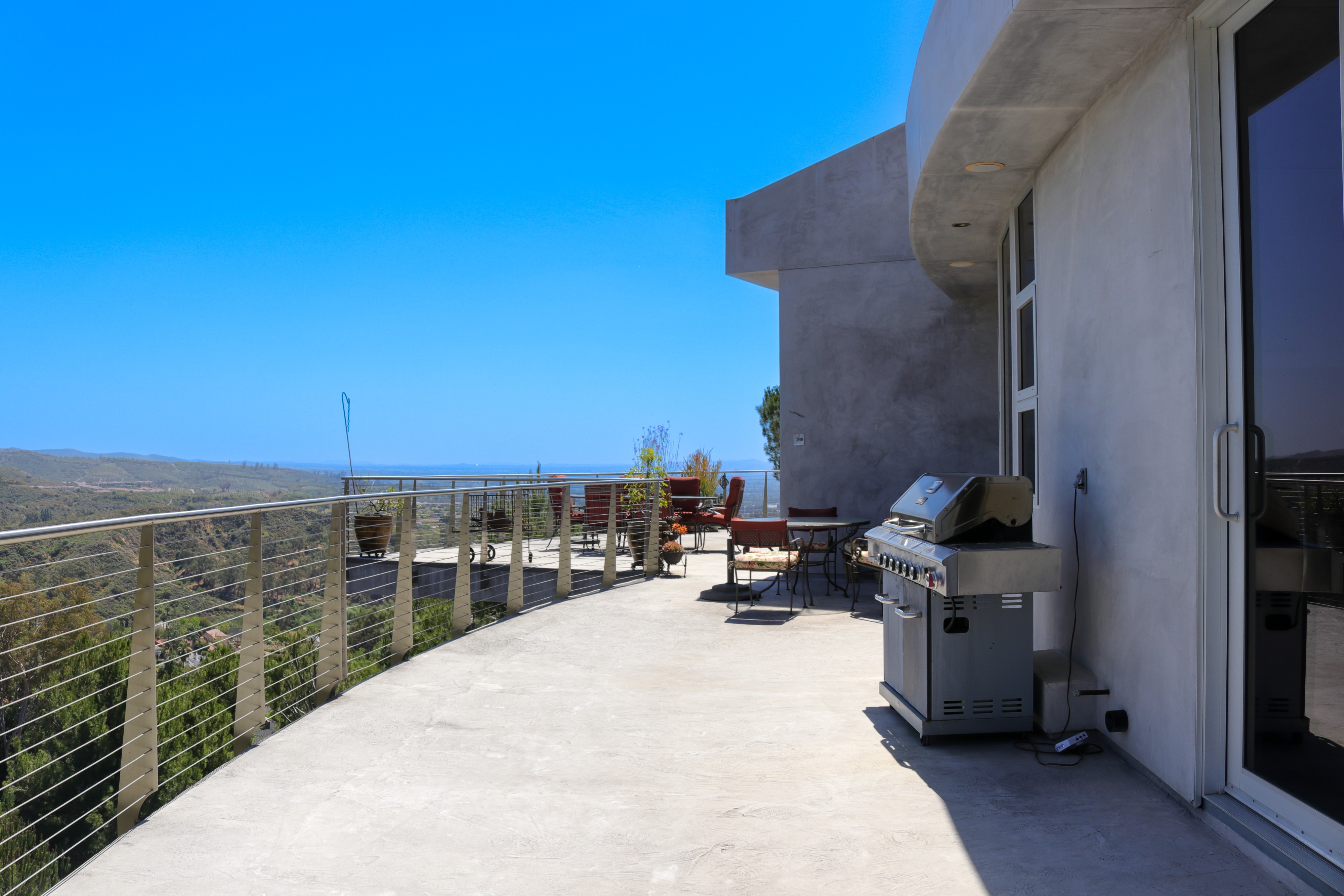 Rooftop terrace with built-in barbecue overlooking the canyon, Tustin hillside home