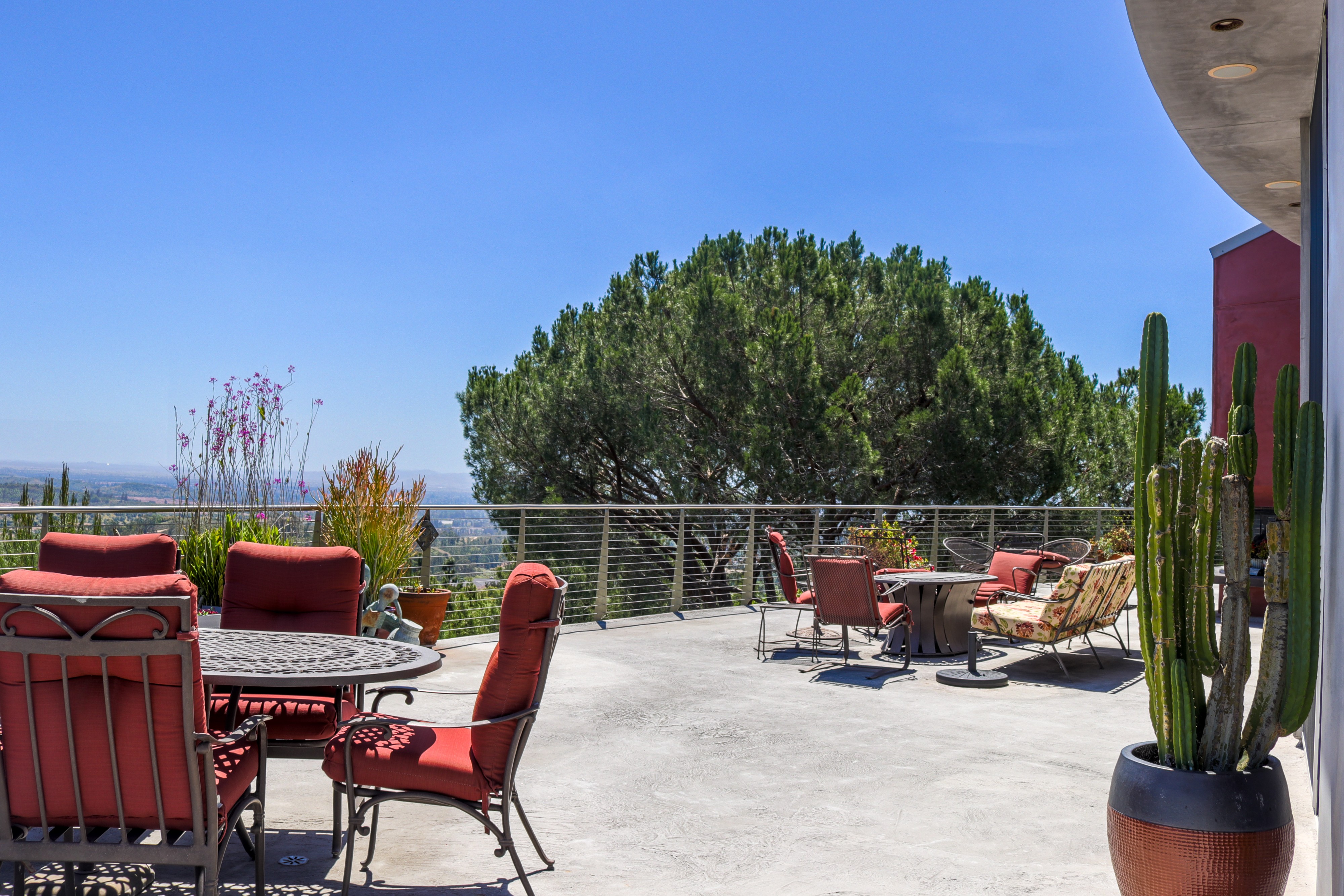 Terrace dining set with panoramic canyon views, Tustin hillside listing