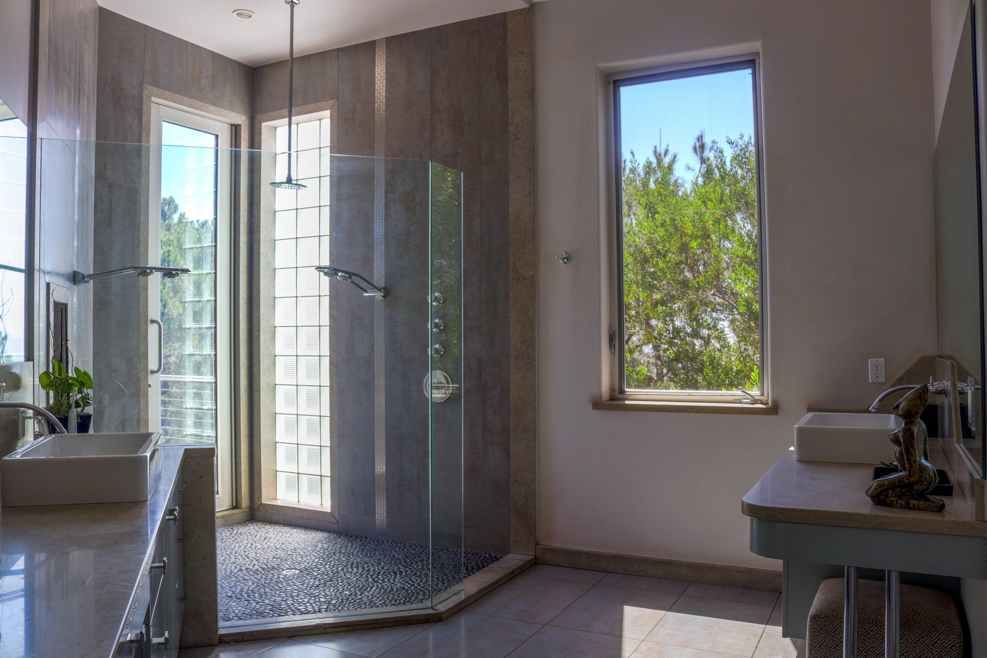 Glass-walled stair hall filled with natural light, Tustin hillside listing