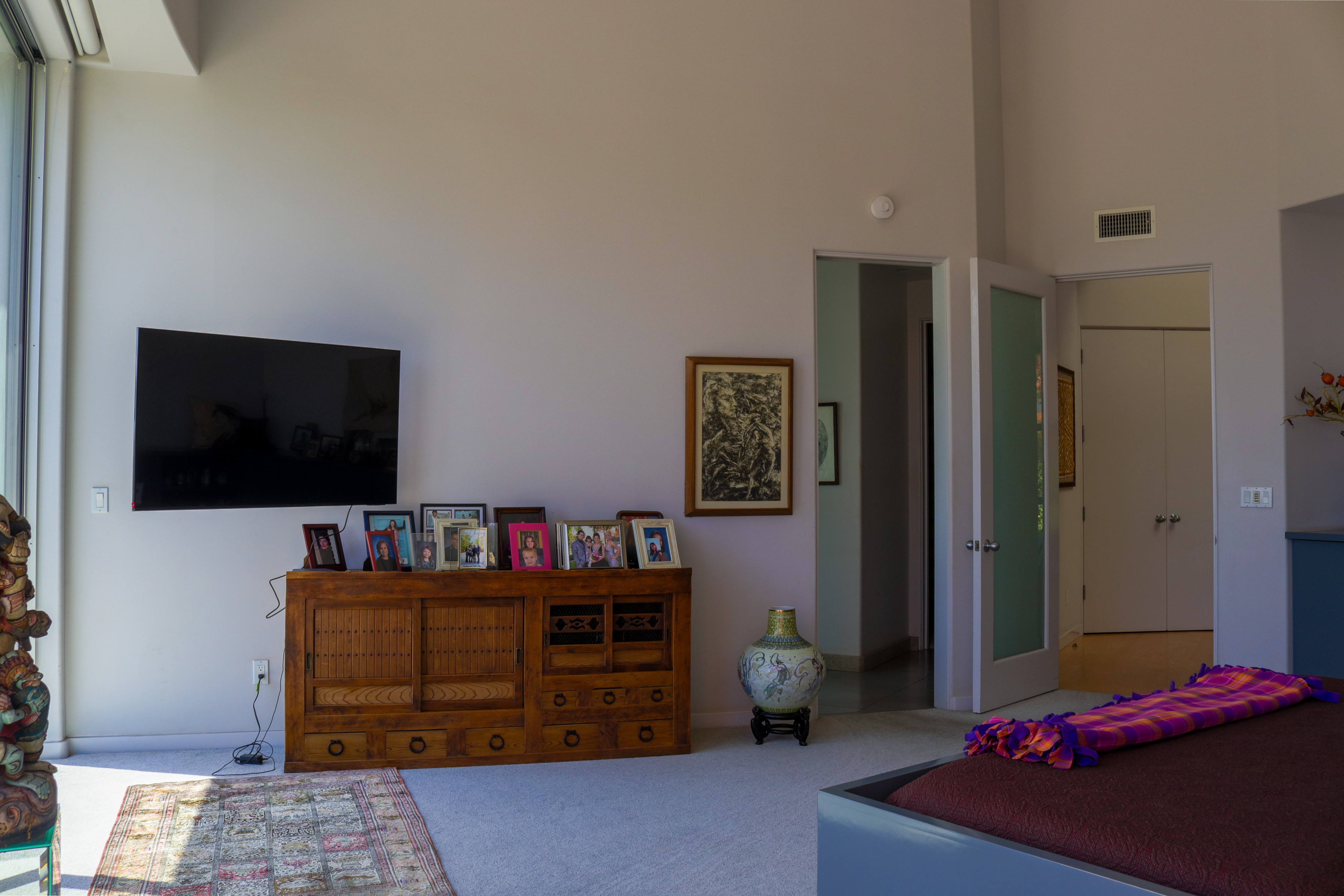 Bedroom with media wall and dresser, Tustin hillside home