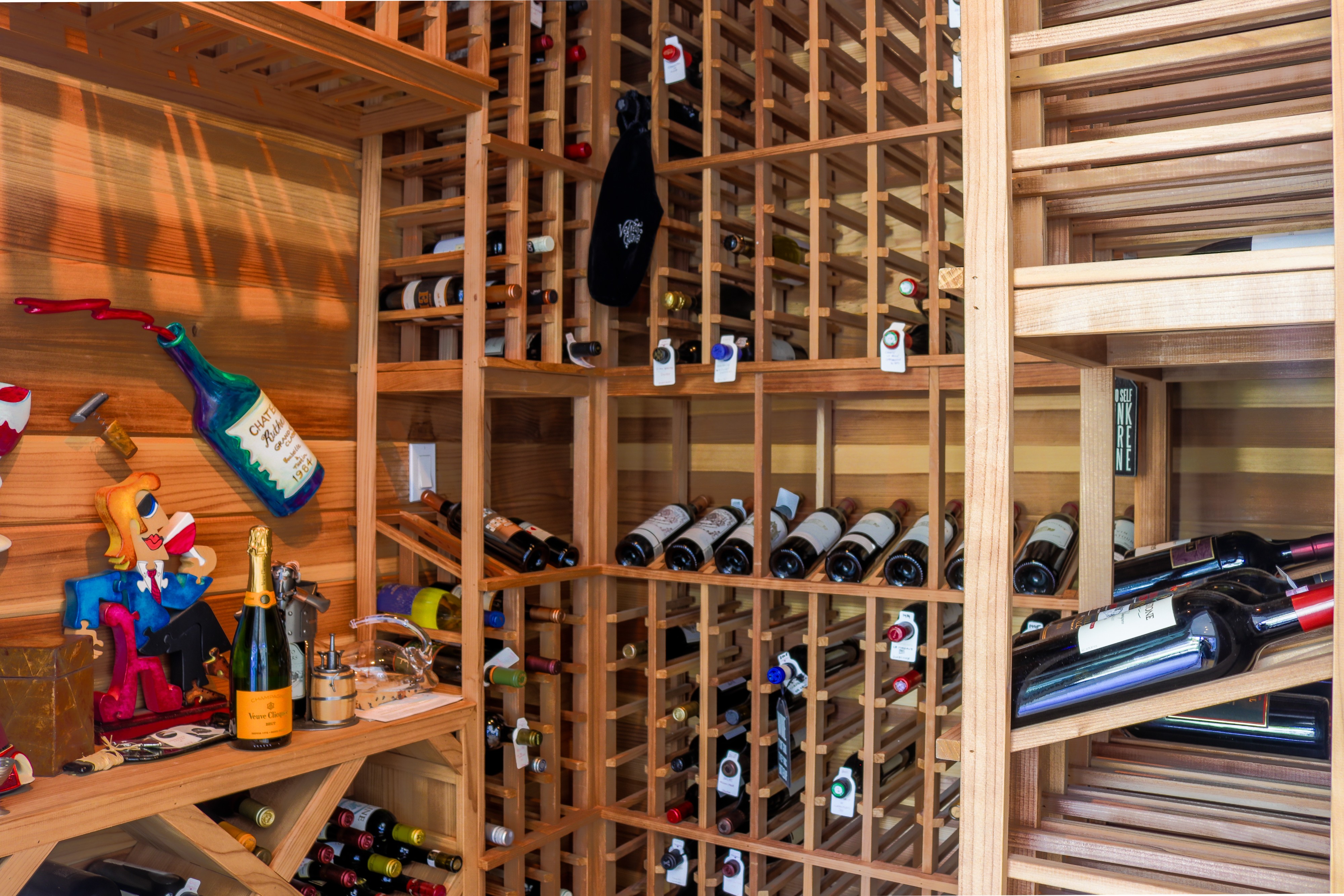 Temperature-controlled wine cellar with full-height wood racking, Tustin luxury home