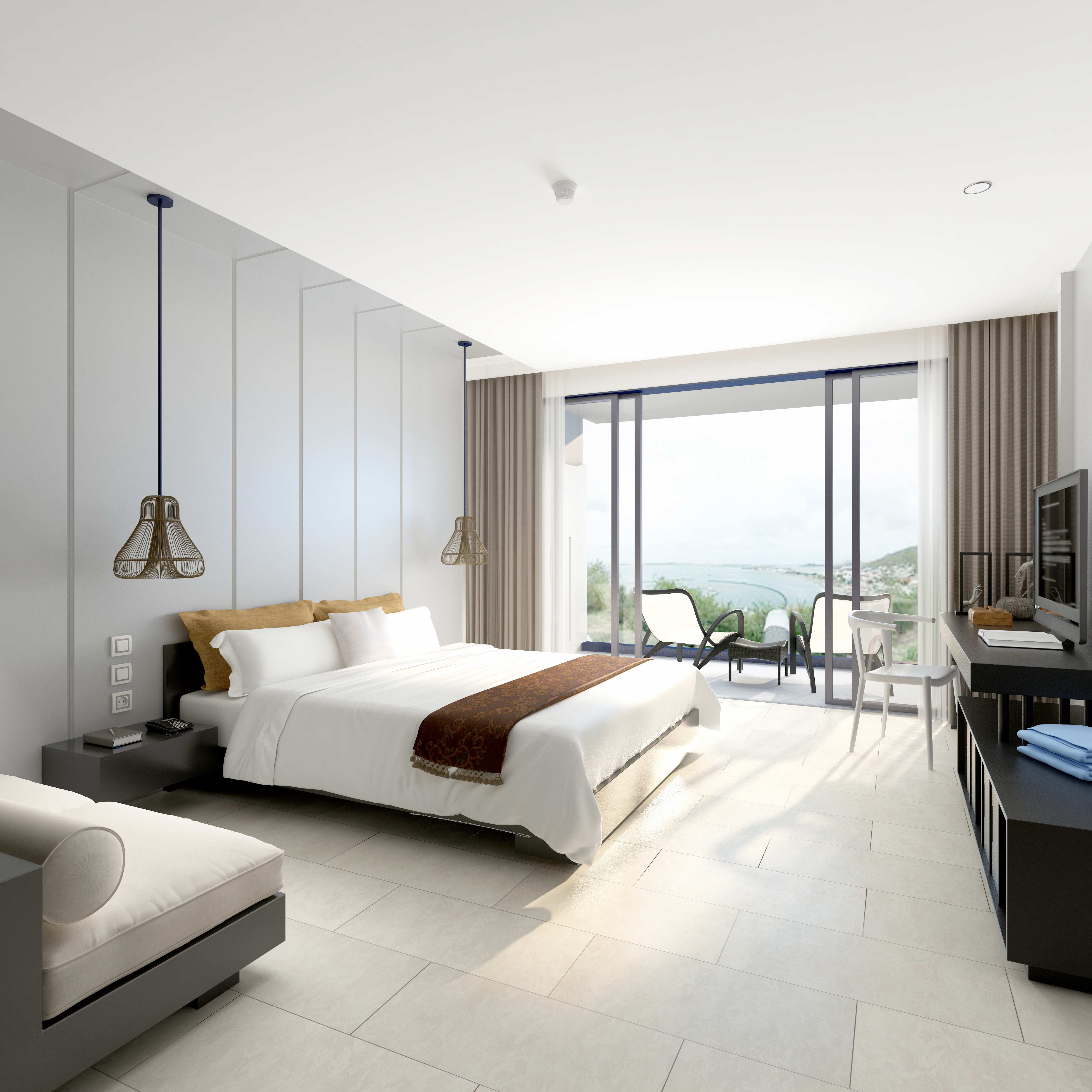 Sunlit boutique hotel guest room with a private balcony and ocean view